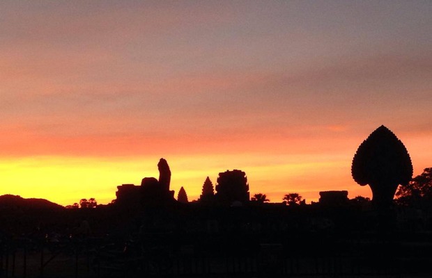 Sunrise at the front of the Angkor Wat temple